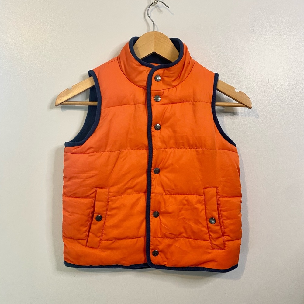 Mini Boden orange puffer vest.